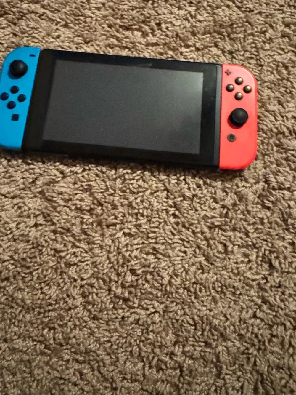 Nintendo Switch with Neon Blue Left and Neon Red Right Joy-Con